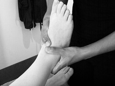 Hands massaging a foot