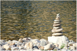Stacked stones near water